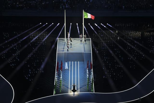 (260206) -- MILAN, Feb. 6, 2026 (Xinhua) -- The Italian national flag is raised during the opening ceremony of the Milan-Cortina 2026 Olympic Winter Games at the San Siro Olympic Stadium in Milan, Italy, Feb. 6, 2026. (Xinhua/Chen Yichen)