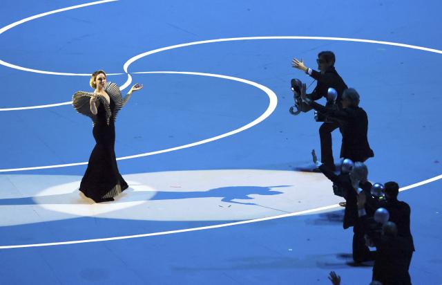 (260206) -- MILAN, Feb. 6, 2026 (Xinhua) -- An artist performs during the opening ceremony of the Milan-Cortina 2026 Olympic Winter Games at the San Siro Olympic Stadium in Milan, Italy, Feb. 6, 2026. (Xinhua/Du Xiaoyi)