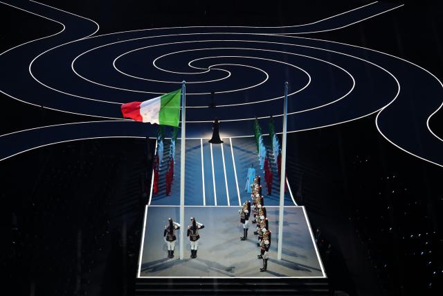 (260206) -- MILAN, Feb. 6, 2026 (Xinhua) -- The Italian national flag is raised during the opening ceremony of the Milan-Cortina 2026 Olympic Winter Games at the San Siro Olympic Stadium in Milan, Italy, Feb. 6, 2026. (Xinhua/Du Xiaoyi)