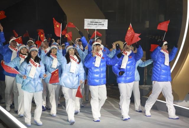 (260206) -- CORTINA D'AMPEZZO, Feb. 6, 2026 (Xinhua) -- Members of the delegation of China attend the parade of athletes during the opening ceremony of the Milan-Cortina 2026 Olympic Winter Games in Cortina, Italy, Feb. 6, 2026. (Xinhua/Zhang Chenlin)