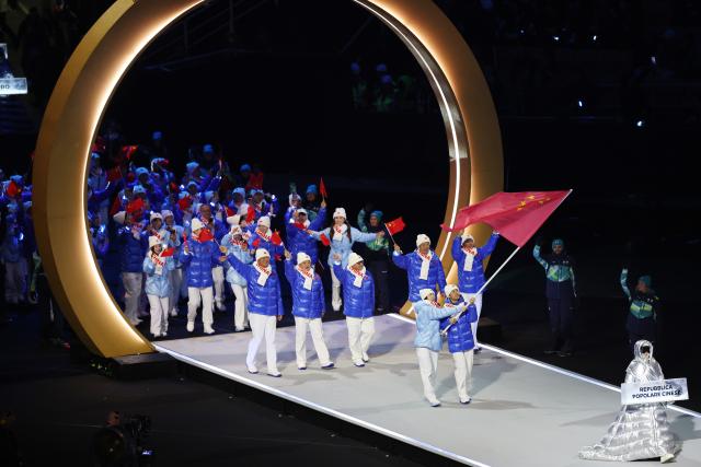 (260206) -- MILAN, Feb. 6, 2026 (Xinhua) -- The delegation of China parades into the San Siro Olympic Stadium during the opening ceremony of the Milan-Cortina 2026 Olympic Winter Games in Milan, Italy, Feb. 6, 2026. (Xinhua/Wang Kaiyan)