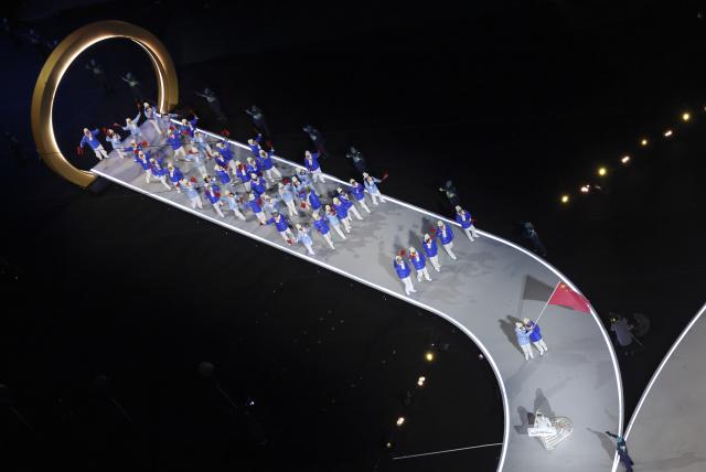 (260206) -- MILAN, Feb. 6, 2026 (Xinhua) -- The delegation of China parades into the San Siro Olympic Stadium during the opening ceremony of the Milan-Cortina 2026 Olympic Winter Games in Milan, Italy, Feb. 6, 2026. (Xinhua/Chen Yichen)