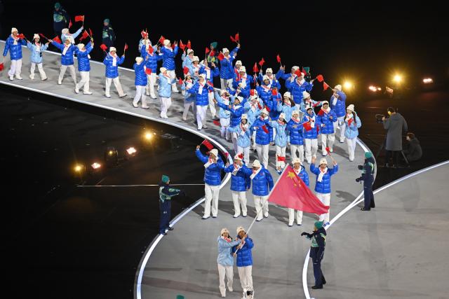 (260206) -- MILAN, Feb. 6, 2026 (Xinhua) -- The delegation of China parades into the San Siro Olympic Stadium during the opening ceremony of the Milan-Cortina 2026 Olympic Winter Games in Milan, Italy, Feb. 6, 2026. (Xinhua/Cheng Min)