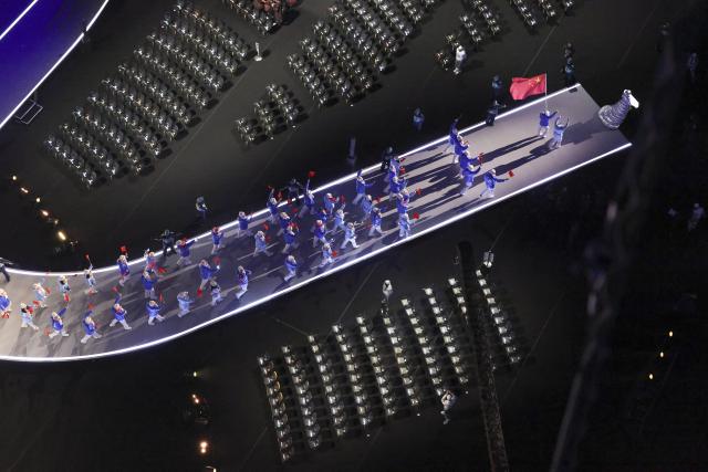 (260206) -- MILAN, Feb. 6, 2026 (Xinhua) -- The delegation of China parades into the San Siro Olympic Stadium during the opening ceremony of the Milan-Cortina 2026 Olympic Winter Games in Milan, Italy, Feb. 6, 2026. (Xinhua/Chen Yichen)