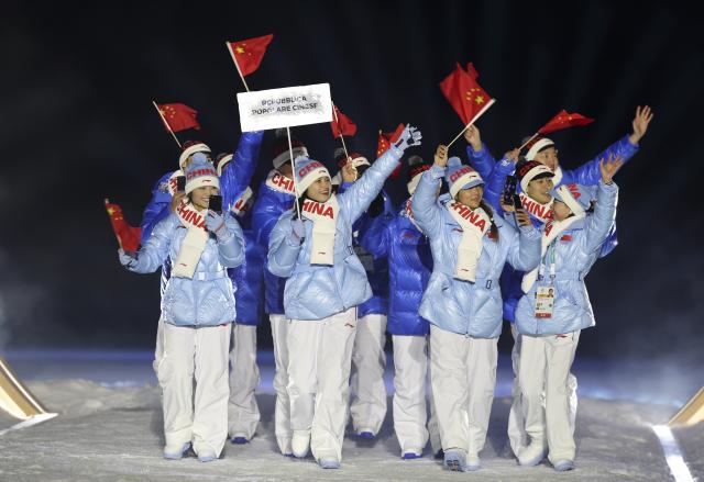(260206) -- PREDAZZO, Feb. 6, 2026 (Xinhua) -- The delegation of China parades into the Predazzo Ski Jumping Stadium during the opening ceremony of the Milan-Cortina 2026 Olympic Winter Games in Predazzo, Italy, Feb. 6, 2026. (Xinhua/Huang Wei)