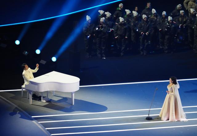 (260206) -- MILAN, Feb. 6, 2026 (Xinhua) -- Chinese pianist Lang Lang (L) and Italian opera singer Cecilia Bartoli perform during the opening ceremony of the Milan-Cortina 2026 Olympic Winter Games at the San Siro Olympic Stadium in Milan, Italy, Feb. 6, 2026. (Xinhua/Xue Yuge)