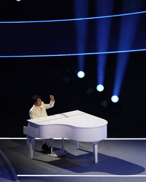 (260206) -- MILAN, Feb. 6, 2026 (Xinhua) -- Chinese pianist Lang Lang performs during the opening ceremony of the Milan-Cortina 2026 Olympic Winter Games at the San Siro Olympic Stadium in Milan, Italy, Feb. 6, 2026. (Xinhua/Wang Kaiyan)
