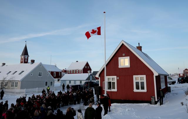 (260206) -- NUUK, Feb. 6, 2026 (Xinhua) -- People raise Canadian flag during the opening ceremony of Canada's new consulate in Nuuk, the capital of Greenland, Denmark, Feb. 6, 2026. On Friday, France and Canada each opened a consulate in Nuuk. (Xinhua/Li Ying)