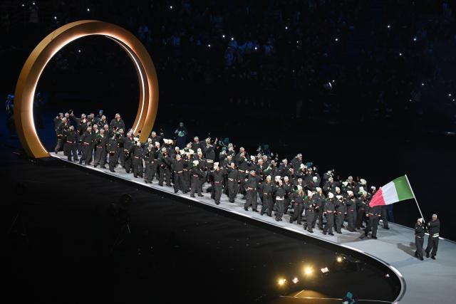 (260207) -- MILAN, Feb. 7, 2026 (Xinhua) -- The delegation of Italy parades into the San Siro Olympic Stadium during the opening ceremony of the Milan-Cortina 2026 Olympic Winter Games in Milan, Italy, Feb. 6, 2026. (Xinhua/Cheng Min)