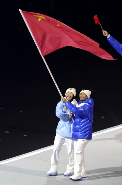 (260207) -- MILAN, Feb. 7, 2026 (Xinhua) -- Chinese athletes carrying the national flag parade into the San Siro Olympic Stadium during the opening ceremony of the Milan-Cortina 2026 Olympic Winter Games in Milan, Italy, Feb. 6, 2026. (Xinhua/Du Xiaoyi)