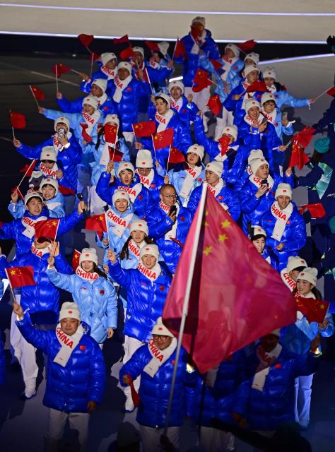 (260207) -- MILAN, Feb. 7, 2026 (Xinhua) -- The delegation of China parades into the San Siro Olympic Stadium during the opening ceremony of the Milan-Cortina 2026 Olympic Winter Games in Milan, Italy, Feb. 6, 2026. (Xinhua/Tao Xiyi)