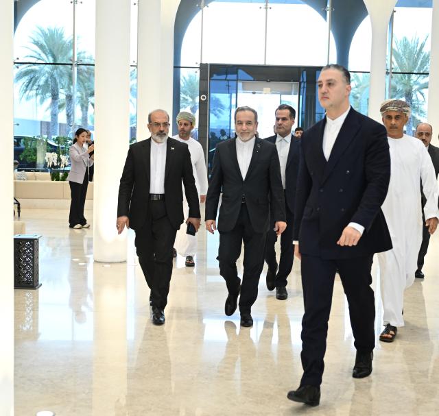 (260207) -- MUSCAT, Feb. 7, 2026 (Xinhua) -- Iranian Foreign Minister Seyed Abbas Araghchi (C) and his accompanying delegation return to hotel after the talks with the United States in Muscat, Oman, Feb. 6, 2026. The indirect talks between Iran and the United States in Oman's Muscat were "a good start," with both sides agreeing to continue negotiations in the future, Iran's Fars News Agency reported Friday, citing Iranian Foreign Minister Seyed Abbas Araghchi. (Xinhua)