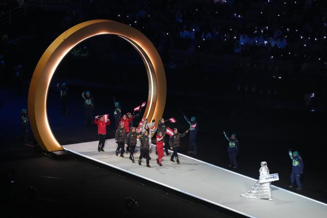 (260207) -- MILAN, Feb. 7, 2026 (Xinhua) -- The delegation of Austria parades into the San Siro Olympic Stadium during the opening ceremony of the Milan-Cortina 2026 Olympic Winter Games in Milan, Italy, Feb. 6, 2026. (Xinhua/Xue Yuge)