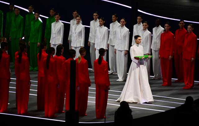 (260207) -- MILAN, Feb. 7, 2026 (Xinhua) -- Vittoria Ceretti carries the Italian national flag to the protocol stage during the opening ceremony of the Milan-Cortina 2026 Olympic Winter Games at the San Siro Olympic Stadium in Milan, Italy, Feb. 6, 2026. (Xinhua/Tao Xiyi)