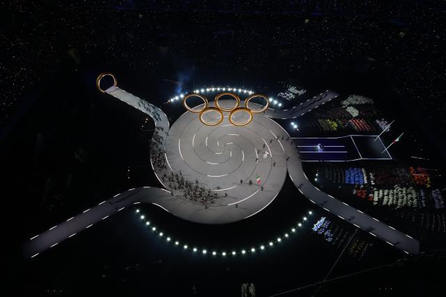 (260207) -- MILAN, Feb. 7, 2026 (Xinhua) -- The delegation of Italy parades into the San Siro Olympic Stadium during the opening ceremony of the Milan-Cortina 2026 Olympic Winter Games in Milan, Italy, Feb. 6, 2026. (Xinhua/Chen Yichen)