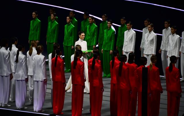 (260207) -- MILAN, Feb. 7, 2026 (Xinhua) -- Vittoria Ceretti carries the Italian national flag to the protocol stage during the opening ceremony of the Milan-Cortina 2026 Olympic Winter Games at the San Siro Olympic Stadium in Milan, Italy, Feb. 6, 2026. (Xinhua/Tao Xiyi)