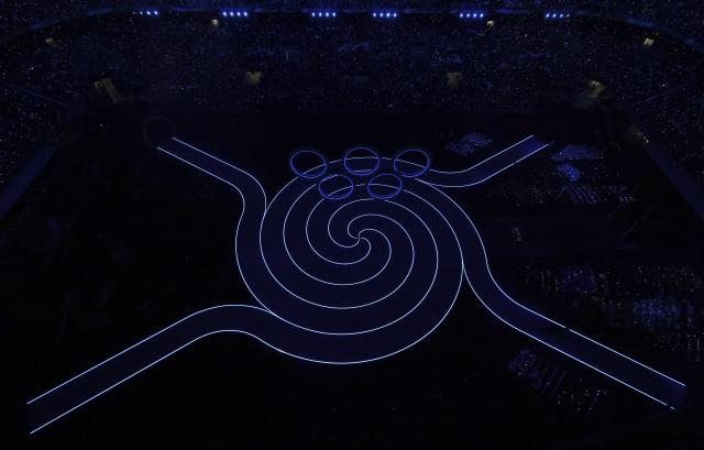 (260207) -- MILAN, Feb. 7, 2026 (Xinhua) -- This photo taken on Feb. 6, 2026 shows the Olympic rings at the opening ceremony of the Milan-Cortina 2026 Olympic Winter Games at the San Siro Olympic Stadium in Milan, Italy. (Xinhua/Chen Yichen)