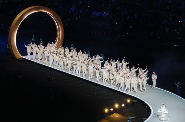 (260207) -- MILAN, Feb. 7, 2026 (Xinhua) -- The delegation of France parades into the San Siro Olympic Stadium during the opening ceremony of the Milan-Cortina 2026 Olympic Winter Games in Milan, Italy, Feb. 6, 2026. (Xinhua/Xue Yuge)