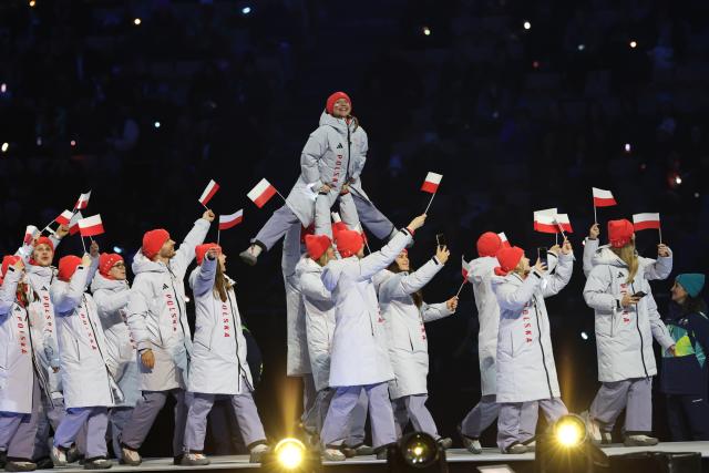 (260207) -- MILAN, Feb. 7, 2026 (Xinhua) -- The delegation of Poland parades into the San Siro Olympic Stadium during the opening ceremony of the Milan-Cortina 2026 Olympic Winter Games in Milan, Italy, Feb. 6, 2026. (Xinhua/Li Jing)