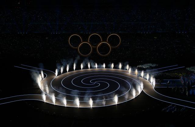 (260207) -- MILAN, Feb. 7, 2026 (Xinhua) -- This photo taken on Feb. 6, 2026 shows the Olympic rings at the opening ceremony of the Milan-Cortina 2026 Olympic Winter Games at the San Siro Olympic Stadium in Milan, Italy. (Xinhua/Xue Yuge)