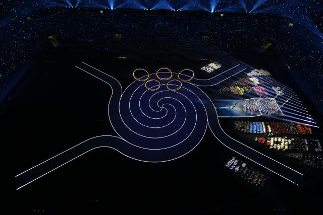 (260207) -- MILAN, Feb. 7, 2026 (Xinhua) -- This photo taken on Feb. 6, 2026 shows the Olympic rings at the opening ceremony of the Milan-Cortina 2026 Olympic Winter Games at the San Siro Olympic Stadium in Milan, Italy. (Xinhua/Chen Yichen)