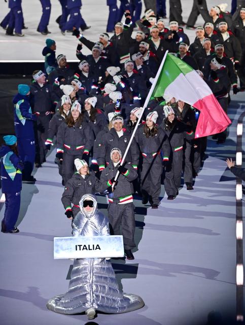 (260207) -- MILAN, Feb. 7, 2026 (Xinhua) -- The delegation of Italy parades into the San Siro Olympic Stadium during the opening ceremony of the Milan-Cortina 2026 Olympic Winter Games in Milan, Italy, Feb. 6, 2026. (Xinhua/Tao Xiyi)