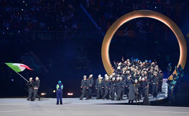 (260207) -- MILAN, Feb. 7, 2026 (Xinhua) -- The delegation of Italy parades into the San Siro Olympic Stadium during the opening ceremony of the Milan-Cortina 2026 Olympic Winter Games in Milan, Italy, Feb. 6, 2026. (Xinhua/Tao Xiyi)