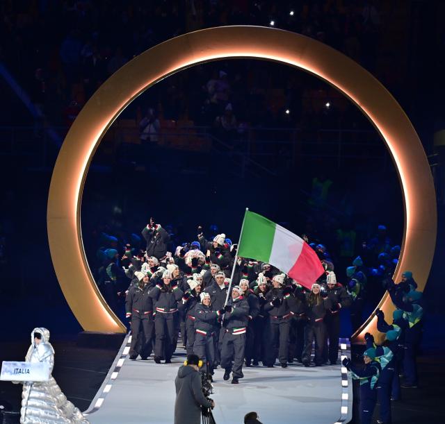 (260207) -- MILAN, Feb. 7, 2026 (Xinhua) -- The delegation of Italy parades into the San Siro Olympic Stadium during the opening ceremony of the Milan-Cortina 2026 Olympic Winter Games in Milan, Italy, Feb. 6, 2026. (Xinhua/Tao Xiyi)