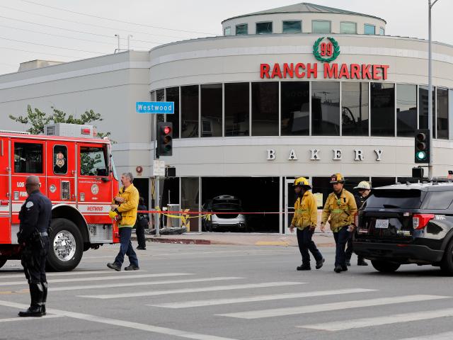 (260207) -- BEIJING, Feb. 7, 2026 (Xinhua) -- Police officers and firefighters are seen at the accident site after a vehicle crashed into the 99 Ranch Market in the Westwood neighborhood in Los Angeles, California, the United States, on Feb. 5, 2026. At least three people were killed and multiple others injured after a vehicle crashed into a grocery store in the Westwood neighborhood in the U.S. city of Los Angeles on Thursday, according to local authorities. (Photo by Qiu Chen/Xinhua)