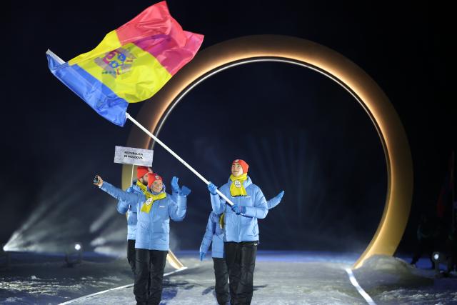 (260207) -- PREDAZZO, Feb. 7, 2026 (Xinhua) -- The delegation of Moldova parades into the Predazzo Ski Jumping Stadium during the opening ceremony of the Milan-Cortina 2026 Olympic Winter Games in Predazzo, Italy, Feb. 6, 2026. (Xinhua/Huang Wei)