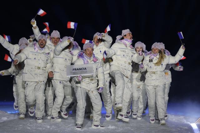 (260207) -- PREDAZZO, Feb. 7, 2026 (Xinhua) -- The delegation of France parades into the Predazzo Ski Jumping Stadium during the opening ceremony of the Milan-Cortina 2026 Olympic Winter Games in Predazzo, Italy, Feb. 6, 2026. (Xinhua/Huang Wei)
