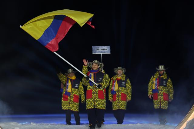 (260207) -- PREDAZZO, Feb. 7, 2026 (Xinhua) -- The delegation of Colombia parades into the Predazzo Ski Jumping Stadium during the opening ceremony of the Milan-Cortina 2026 Olympic Winter Games in Predazzo, Italy, Feb. 6, 2026. (Xinhua/Huang Wei)