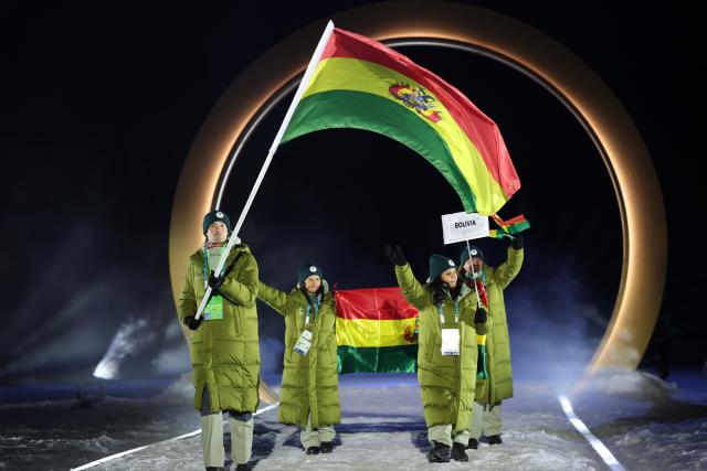 (260207) -- PREDAZZO, Feb. 7, 2026 (Xinhua) -- The delegation of Bolivia parades into the Predazzo Ski Jumping Stadium during the opening ceremony of the Milan-Cortina 2026 Olympic Winter Games in Predazzo, Italy, Feb. 6, 2026. (Xinhua/Huang Wei)