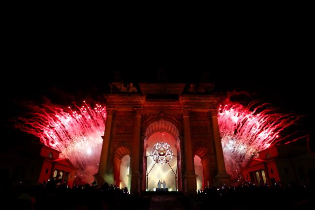(260207) -- MILAN, Feb. 7, 2026 (Xinhua) -- Torchbearers Deborah Compagnoni (R) and Alberto Tomba ignite the cauldron of the Milan-Cortina 2026 Olympic Winter Games at the Arco della Pace in Milan, Italy, Feb. 6, 2026. (Jamie Squire/Pool via Xinhua)