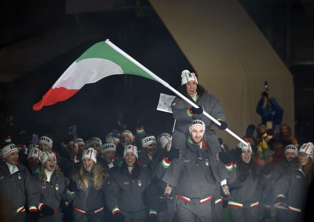 (260207) -- CORTINA D'AMPEZZO, Feb. 7, 2026 (Xinhua) -- The delegation of Italy parades into the City Center during the opening ceremony of the Milan-Cortina 2026 Olympic Winter Games in Cortina, Italy, Feb. 6, 2026. (Xinhua/Zhang Chenlin)
