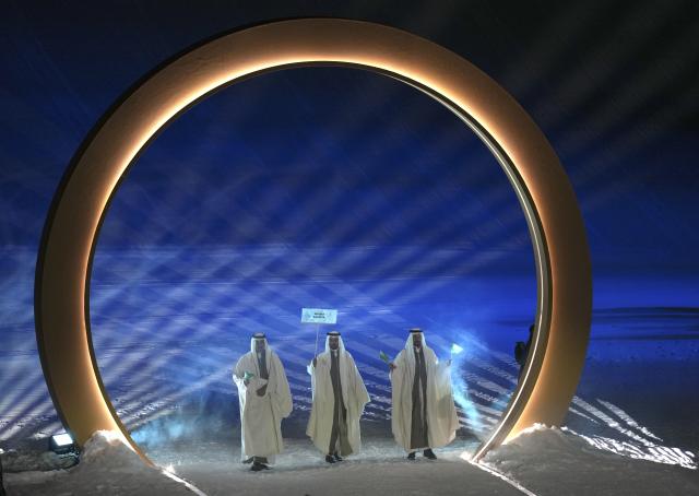 (260207) -- LIVIGNO, Feb. 7, 2026 (Xinhua) -- Members of the delegation of Saudi Arabia attend the parade of athletes during the opening ceremony of the Milan-Cortina 2026 Olympic Winter Games in Livigno, Italy, Feb. 6, 2026. (Xinhua/Xia Yifang)