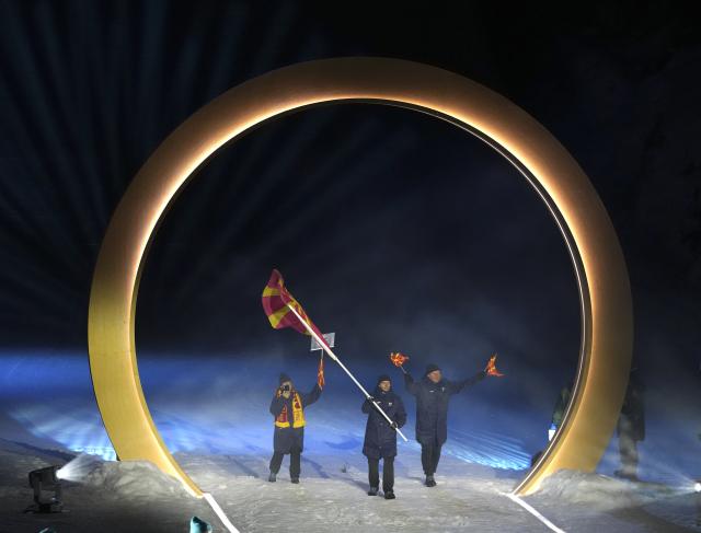 (260207) -- PREDAZZO, Feb. 7, 2026 (Xinhua) -- The delegation of North Macedonia parades into the Predazzo Ski Jumping Stadium during the opening ceremony of the Milan-Cortina 2026 Olympic Winter Games in Predazzo, Italy, Feb. 6, 2026. (Xinhua/Meng Yongmin)