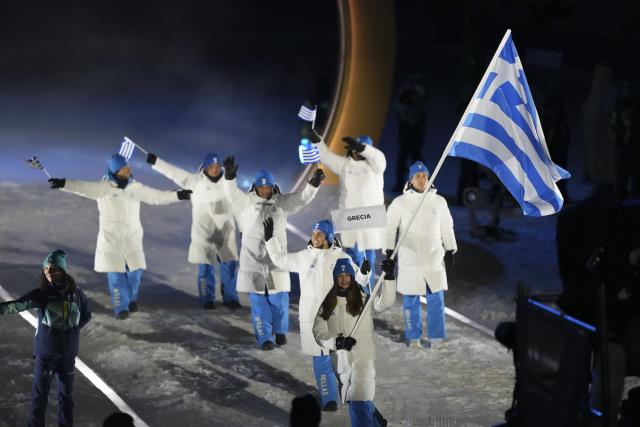 (260207) -- LIVIGNO, Feb. 7, 2026 (Xinhua) -- Members of the delegation of Greece attend the parade of athletes during the opening ceremony of the Milan-Cortina 2026 Olympic Winter Games in Livigno, Italy, Feb. 6, 2026. (Xinhua/Meng Yongmin)