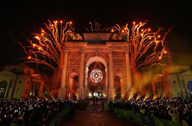 (260207) -- MILAN, Feb. 7, 2026 (Xinhua) -- Fireworks illuminate the night sky at the Arco della Pace during the opening ceremony of the Milan-Cortina 2026 Olympic Winter Games in Milan, Italy, Feb. 6, 2026. (Xinhua/Sun Fei)