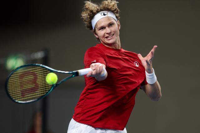 (260207) -- VARAZDIN, Feb. 7, 2026 (Xinhua) -- August Holmgren of Team Denmark hits a return in the second match against Dino Prizmic of Team Croatia during the Davis Cup Qualifier first round match between Croatia and Denmark in Varazdin, Croatia, on Feb. 6, 2026. (Photo by Igor Kralj/PIXSELL via Xinhua)