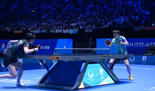 (260207) -- HAIKOU, Feb. 7, 2026 (Xinhua) -- Sun Yingsha (R) competes with Kim Nayeong during the women's singles round of 16 match between Sun Yingsha of China and Kim Nayeong of South Korea at the ITTF-ATTU Asian Cup Haikou 2026 table tennis tournament in Haikou, south China's Hainan Province, Feb. 7, 2026. (Xinhua/Yang Guanyu)