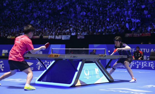 (260207) -- HAIKOU, Feb. 7, 2026 (Xinhua) -- Wang Chuqin (R) of China and Izaac Quek of Singapore compete during the men's singles round of 16 match between Wang Chuqin of China and Izaac Quek of Singapore at the ITTF-ATTU Asian Cup Haikou 2026 table tennis tournament in Haikou, south China's Hainan Province, Feb. 7, 2026. (Xinhua/Yang Guanyu)