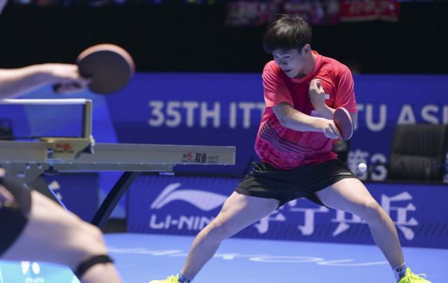(260207) -- HAIKOU, Feb. 7, 2026 (Xinhua) -- Izaac Quek hits a return during the men's singles round of 16 match between Wang Chuqin of China and Izaac Quek of Singapore at the ITTF-ATTU Asian Cup Haikou 2026 table tennis tournament in Haikou, south China's Hainan Province, Feb. 7, 2026. (Xinhua/Yang Guanyu)