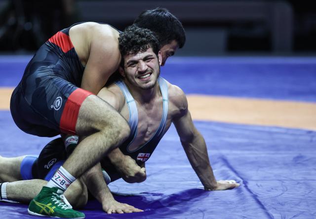 (260207) -- ZAGREB, Feb. 7, 2026 (Xinhua) -- Aytjan Khalmakhanov of Uzbekistan (L) competes against Diego Chkhikvadze of Georgia during UWW Grand Prix Ranking Series Zagreb Open 2026 Men's Greco-Roman 67kg weight class gold medal match in Zagreb, Croatia, Feb. 6, 2026. (Photo by Slavko Midzor/PIXSELL via Xinhua)