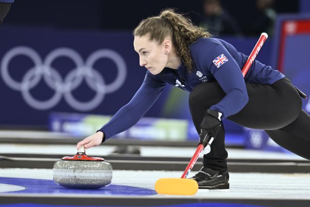 (260207) -- CORTINA D'AMPEZZO, Feb. 7, 2026 (Xinhua) -- Jennifer Dodds of Britain competes during the curling mixed doubles round robin session 7 match between Britain and Canada of the 2026 Milan-Cortina Winter Olympics in Cortina D'Ampezzo, Italy, Feb. 7, 2026. (Xinhua/Lian Yi)