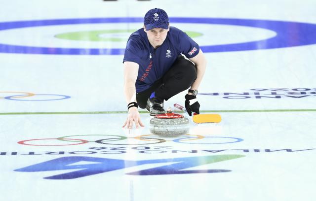 (260207) -- CORTINA D'AMPEZZO, Feb. 7, 2026 (Xinhua) -- Bruce Mouat of Britain competes during the curling mixed doubles round robin session 7 match between Britain and Canada of the 2026 Milan-Cortina Winter Olympics in Cortina D'Ampezzo, Italy, Feb. 7, 2026. (Xinhua/Lian Yi)