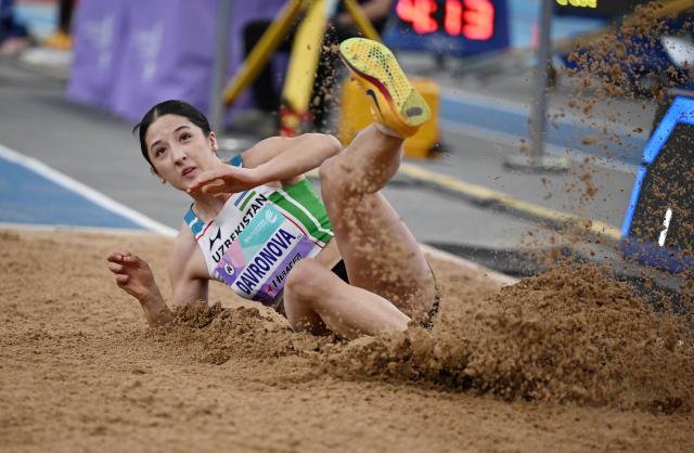 (260207) -- TIANJIN, Feb. 7, 2026 (Xinhua) -- Sharifa Davronova of Uzbekistan competes during the women's triple jump final at the 12th Asian Indoor Athletics Championships 2026 in Tianjin, north China, Feb. 7, 2026. (Xinhua/Zhao Zishuo)