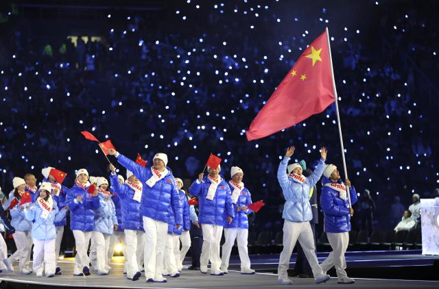 (260207) -- BEIJING, Feb. 7, 2026 (Xinhua) -- The delegation of the People's Republic of China parades into the Predazzo Ski Jumping Stadium during the opening ceremony of the Milan-Cortina 2026 Olympic Winter Games in Predazzo, Italy, Feb. 6, 2026. (Xinhua/Li Ming)