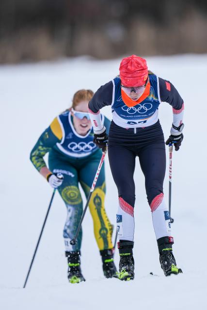 (260207) -- TESERO, Feb. 7, 2026 (Xinhua) -- He Kaile (front) of China competes during the Cross-Country Skiing Women's 10km+10km Skiathlon of the Milan-Cortina 2026 Olympic Winter Games in Tesero, Italy, Feb. 7, 2026. (Xinhua/Peng Ziyang)
