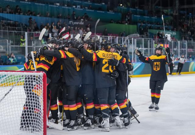 (260207) -- MILAN, Feb. 7, 2026 (Xinhua) -- Players of Germany celebrate after winning the ice hockey women's preliminary round group B match between Germany and Japan of the Milan-Cortina 2026 Olympic Winter Games in Milan, Italy, Feb. 7, 2026. (Xinhua/Sun Fei)
